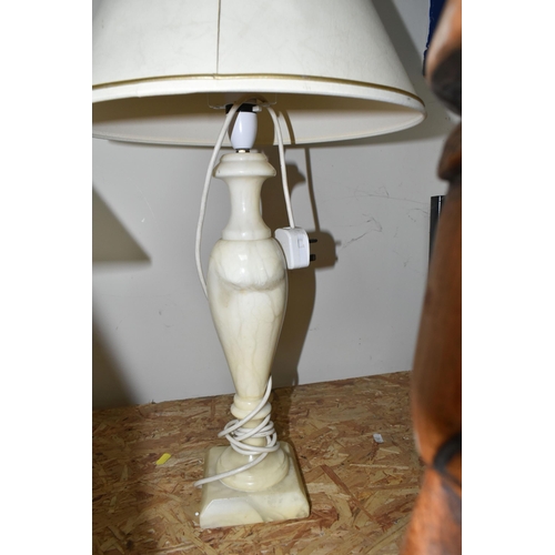 332 - A GROUP OF FOUR TABLE LAMPS AND CARVED WOOD FIGURES, comprising a cream onyx table lamp, a figural '... 