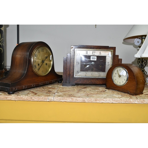 333 - A GROUP OF THREE ART DECO WOODEN CASED MANTEL CLOCKS, comprising a square stepped clock mechanism ma... 