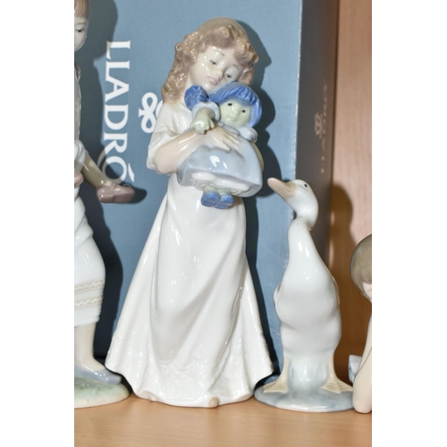 374 - A GROUP LLADRO AND NAO FIGURES, comprising a boxed Lladro 8353 'Oh Happy Days' figure designed by Ja... 