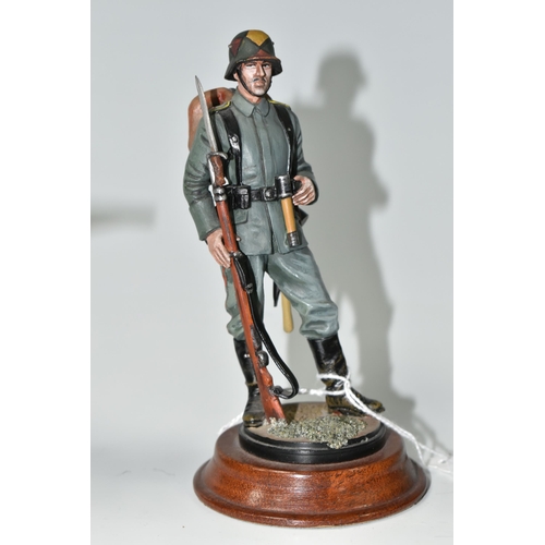 405 - FOUR DIECAST FIGURES OF SOLDIERS, in British and German First World War uniforms, with weapons etc.,... 