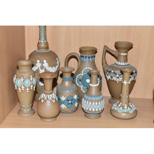 424 - A GROUP OF DOULTON LAMBETH SILICON WARE VASES AND JUGS, sixteen pieces with applied floral, foliate ... 