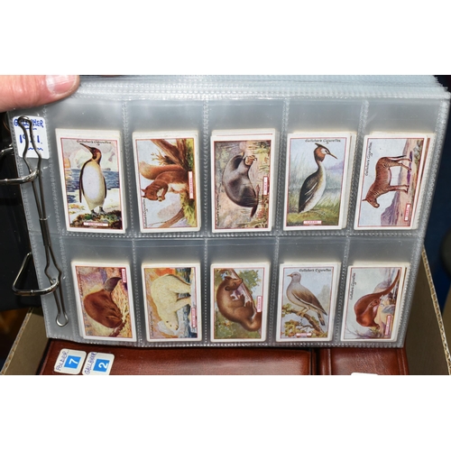 458 - SIX ALBUMS OF CIGARETTE CARDS containing approximately fifty-five sets from Gallaher, Ogden's, John ... 