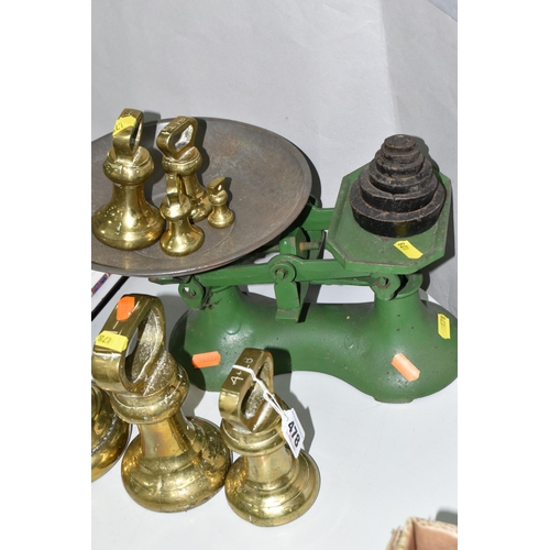 478 - A SET OF CAST BALANCE SCALES AND BRASS WEIGHTS, comprising a green painted set of cast scales with a... 