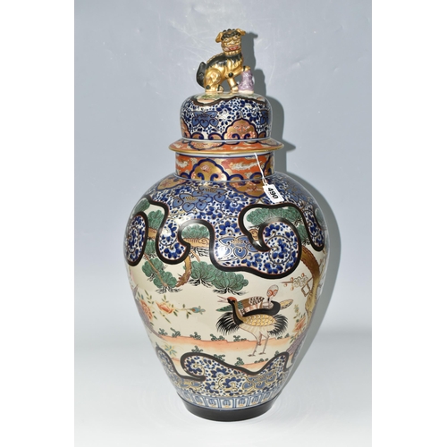 490 - A LARGE ORIENTAL COVERED VASE, comprising a hand painted gilt edged floral design with insects and e... 