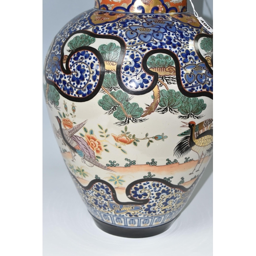 490 - A LARGE ORIENTAL COVERED VASE, comprising a hand painted gilt edged floral design with insects and e... 