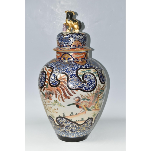 490 - A LARGE ORIENTAL COVERED VASE, comprising a hand painted gilt edged floral design with insects and e... 