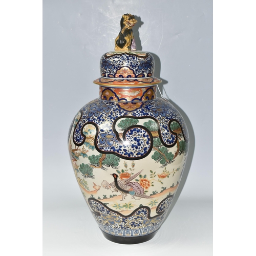 490 - A LARGE ORIENTAL COVERED VASE, comprising a hand painted gilt edged floral design with insects and e... 