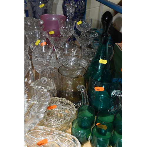 595 - A SELECTION OF CLEAR AND COLOURED GLASSWARES, to include a Skruf of Sweden green decanter with six g... 