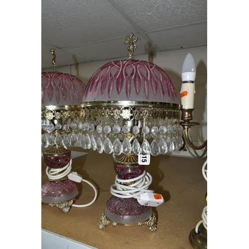 615 - A GROUP OF TABLE LAMPS, comprising a pair of gilt metal lamp bases with two bulb fittings on each, h... 