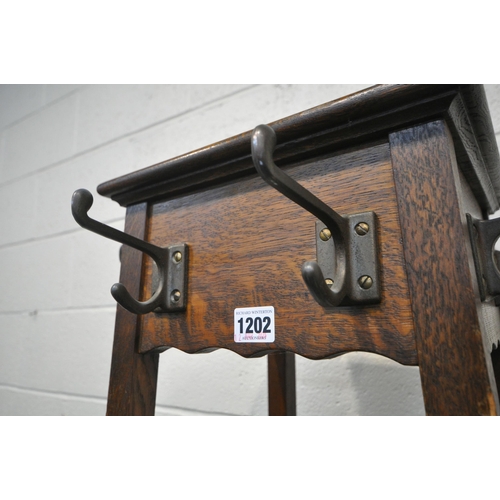 1202 - A 20TH CENTURY OAK HALL COAT/HAT STAND, with eight hooks, 43cm squared x height 184cm (condition rep... 