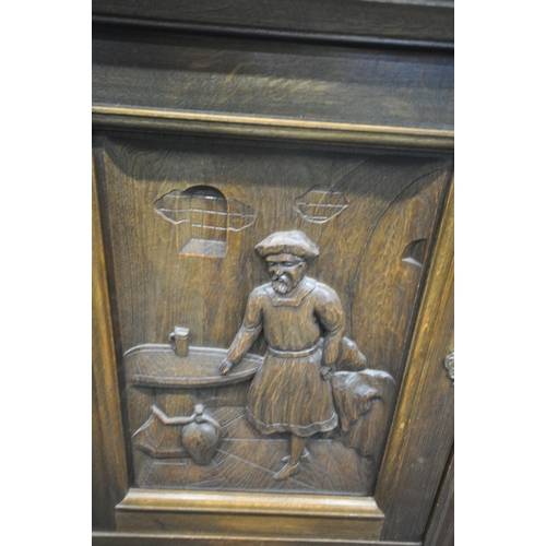 1213 - A 20TH CENTURY OAK CABINET, with two cupboard doors, carved with men in two different settings, abov... 