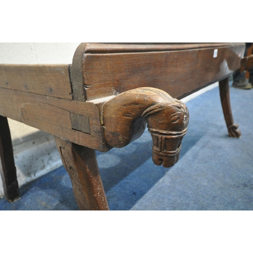 1215 - A TRIBAL TWO SEATER TOILET BENCH OF RECTANGULAR FORM, one side with a carved horse's head to each en... 