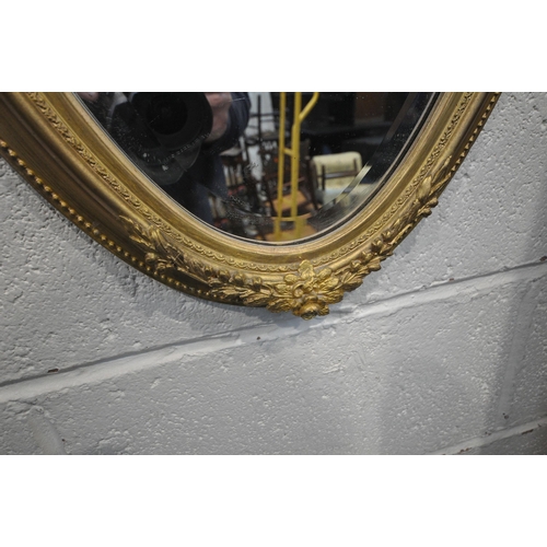 1219 - A VARIETY OF MIRRORS, to include an oval gilt resin bevelled edge wall mirror, 44cm x 88cm, a small ... 