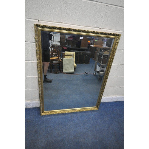 1220 - A RECTANGULAR GILT FRAMED BEVELLED EDGE WALL MIRROR, 99cm x 129cm (condition report: overall good co... 