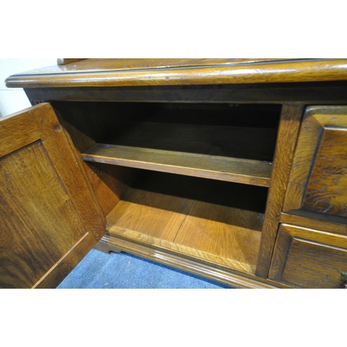 1237 - A GOOD QUALITY REPRODUCTION ELM DRESSER, the top two tier bookcase, atop a base that's fitted with t... 