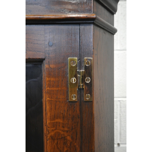 1239 - A TITCHMARSH AND GOODWIN OAK CORNER CUPBOARD, a single glazed door, above a cupboard door, width 70c... 