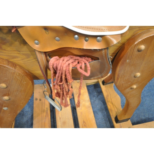 1253 - A PINE FRAMED ROCKING HORSE (condition report: tail loose, surface marks, scuffs, other signs of usa... 