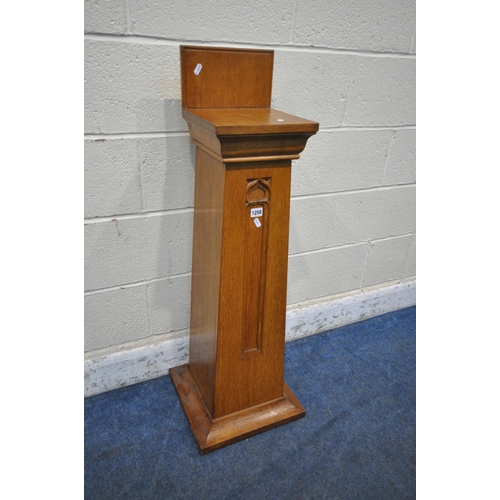 1258 - A 20TH CENTURY OAK CHURCH COLLECTION BOX, with a raised back, small money slot, raised on a tapered ... 