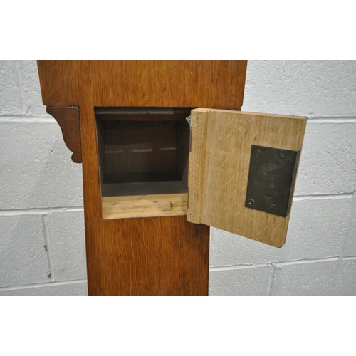 1258 - A 20TH CENTURY OAK CHURCH COLLECTION BOX, with a raised back, small money slot, raised on a tapered ... 