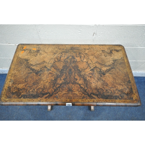 1261 - A 19TH CENTURY BURR WALNUT WORK TABLE, the revolving fold over top, enclosing a green baize, above a... 