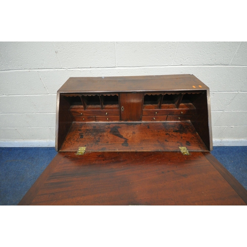 1265 - A GEORGIAN MAHOGANY BUREAU, the fall front door, enclosing a fitted interior, above four drawers, on... 