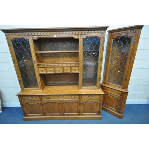 1267 - A 20TH CENTURY OAK JAYCEE DRESSER, the top with double lead glazed doors, that are enclosing glass s... 