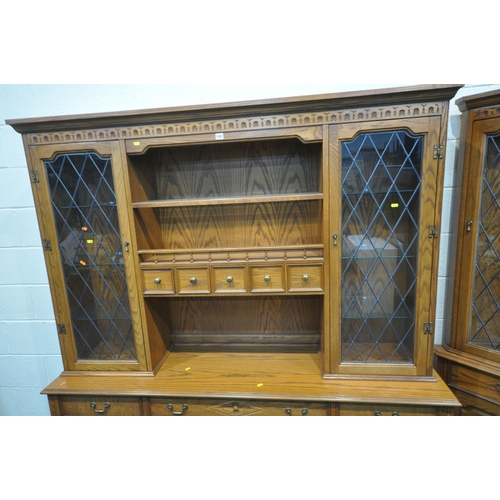 1267 - A 20TH CENTURY OAK JAYCEE DRESSER, the top with double lead glazed doors, that are enclosing glass s... 