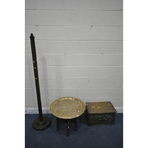 1274 - AN ISLAMIC ENGRAVED BRASS TRAY TABLE, on a folding wooden base, with mother of pearl inlay, diameter... 