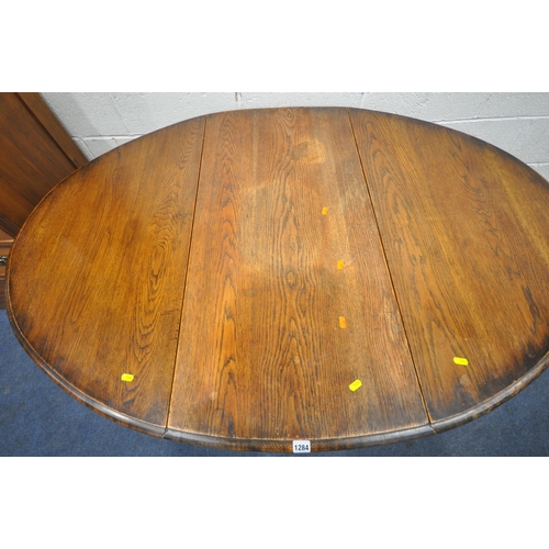 1284 - A 20TH CENTURY OAK OVAL BARLEY TWIST GATE LEG TABLE, open width 150cm x closed width 54cm x depth 10... 