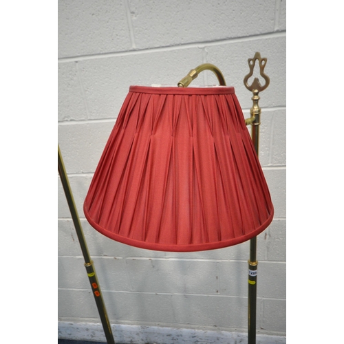 1289 - A PAIR OF LAURA ASHLEY BRASS STANDARD LAMPS, with shaped neck and red pleated shades, height 138cm (... 