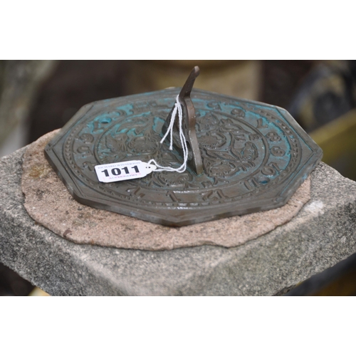 1011 - A MODERN COMPOSITE AND BRASS SUN DIAL with a two tiered square foot, baluster column and a loose hex... 