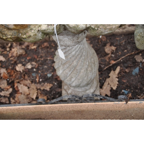 1014 - A MID 20th CENTURY BIRD BATH with an oyster shell bowl on a twisted fluted balusters column height 8... 