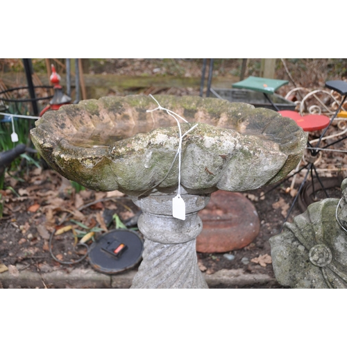 1014 - A MID 20th CENTURY BIRD BATH with an oyster shell bowl on a twisted fluted balusters column height 8... 