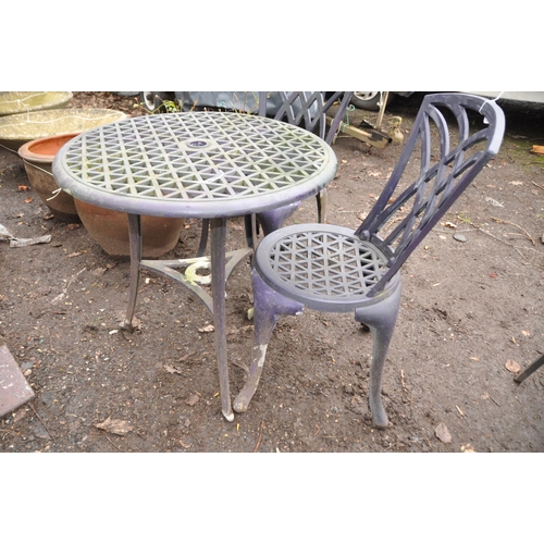 1017 - A CAST ALUMINIUM THREE PIECE GARDEN SET with a 67cm diameter round table and two chairs all with lat... 