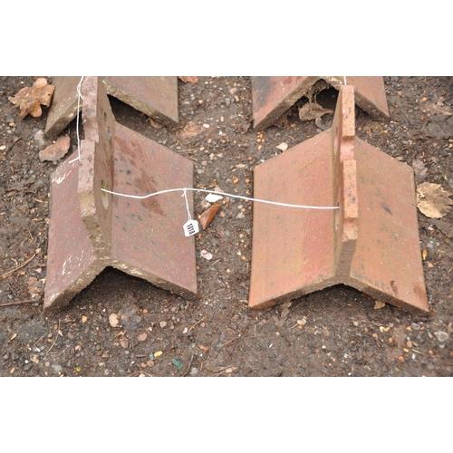 1018 - FOUR VICTORIAN RIDGE TILES with castellated tops