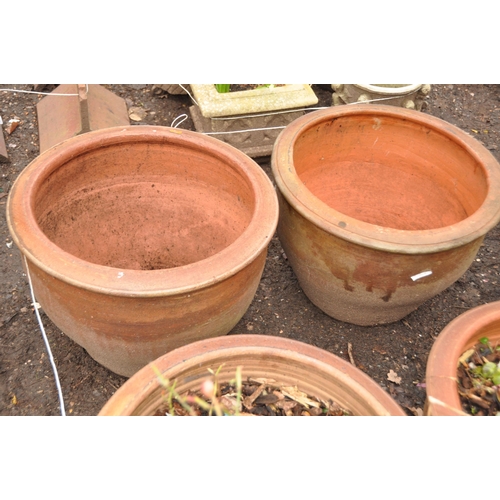 1026 - FOUR SIMILAR LARGE PLANTERS in terracotta colour all 52cm in diameter (4)