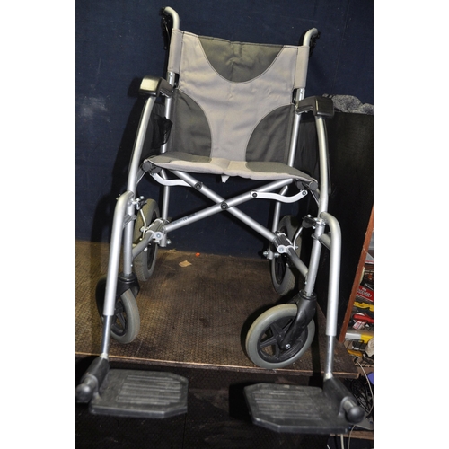 1077 - A DRIVE MEDICAL ENIGMA FOLDING WHEELCHAIR with two footrests