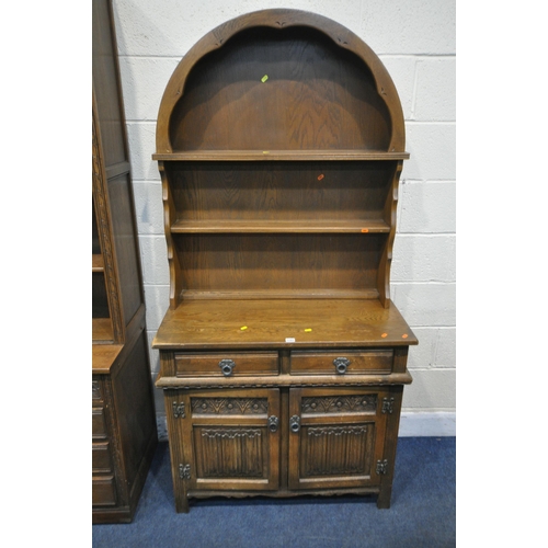 1293 - A 20TH CENTURY OLD CHARM OAK DRESSER, the arched two tier plate rack, atop a base with two drawers a... 