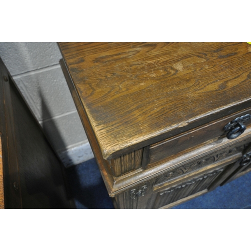 1293 - A 20TH CENTURY OLD CHARM OAK DRESSER, the arched two tier plate rack, atop a base with two drawers a... 