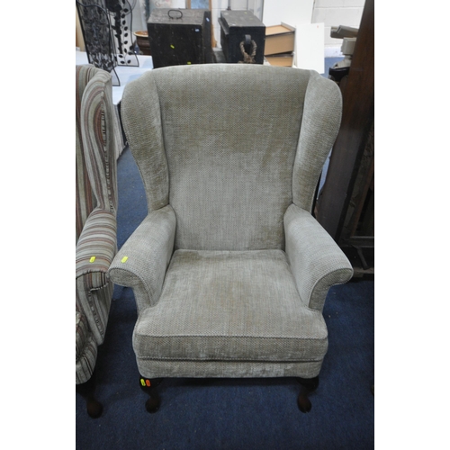 1304 - TWO PARKER KNOLL UPHOLSTERED WING BACK ARMCHAIRS, one stripped and the other beige (condition report... 