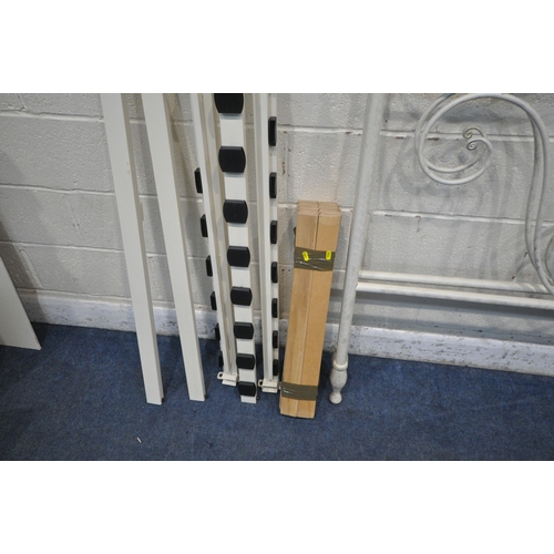 1305 - A WHITE TUBULAR 4FT6 BEDSTEAD, with side rails and slats, along with another white tubular metal hea... 