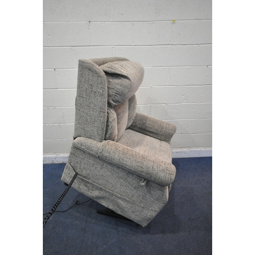 1306 - A BEIGE UPHOLSTERED RISE AND RECLINE ARMCHAIR (condition report: loose fabric to seam on the back, i... 