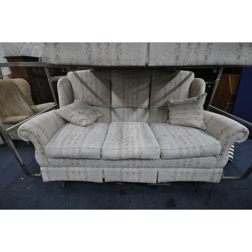 1310 - WADE UPHOLSTERY, A BEIGE UPHOLSTERED TWO PIECE LOUNGE SUITE, comprising a three seater sofa, along w... 