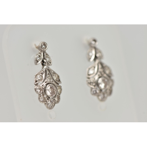 13 - A PAIR OF WHITE METAL, DIAMOND DROP EARRINGS, each earring set with a central round brilliant cut di... 