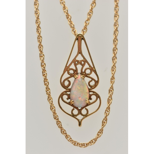 18 - AN 18CT GOLD OPAL PENDANT WITH CHAIN, open work scrolling pattern pendant, set with a pear cut opal ... 