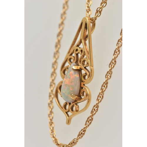 18 - AN 18CT GOLD OPAL PENDANT WITH CHAIN, open work scrolling pattern pendant, set with a pear cut opal ... 