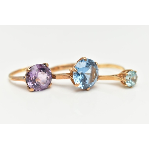 22 - AN 18CT GOLD ZIRCON RING AND TWO GEM SET RINGS, the first set with a circular cut light blue zircon,... 