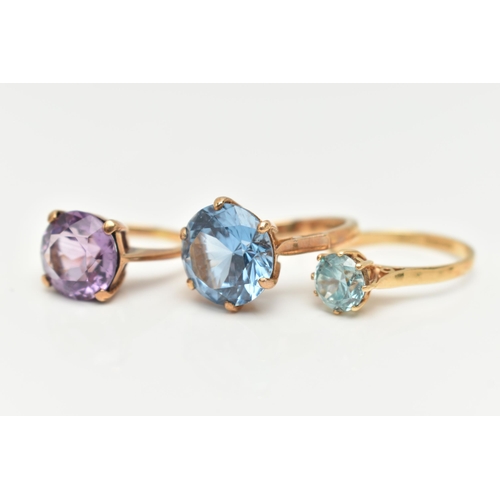 22 - AN 18CT GOLD ZIRCON RING AND TWO GEM SET RINGS, the first set with a circular cut light blue zircon,... 