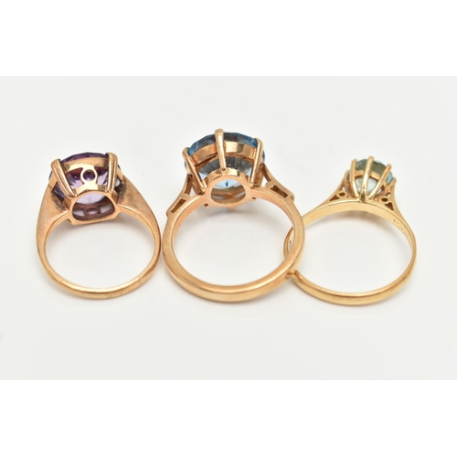 22 - AN 18CT GOLD ZIRCON RING AND TWO GEM SET RINGS, the first set with a circular cut light blue zircon,... 