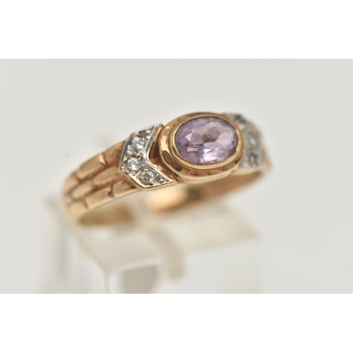 26 - A 9CT GOLD AMETHYST RING, the central oval amethyst in a collet setting, flanked by colourless paste... 